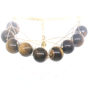 Load image into Gallery viewer, Tiger-Eye Figure 8 Eternity Gold in Color Bracelet
